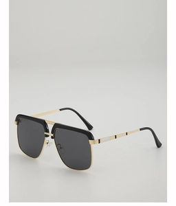 Detail of classic square sunglasses showing golden metal bridge and striped temple arms
