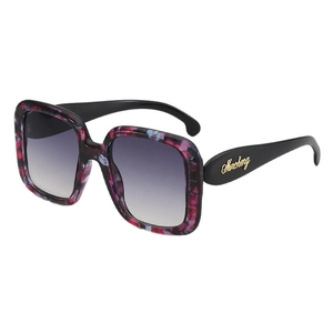 Oversized square sunglasses with floral multi-color frames and purple gradient lenses