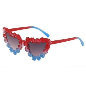 Kids heart shaped sunglasses with colorful daisy floral accents and blue red gradient frame