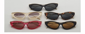 Collection of vintage cat eye sunglasses in black, tortoiseshell, and rose pink colors