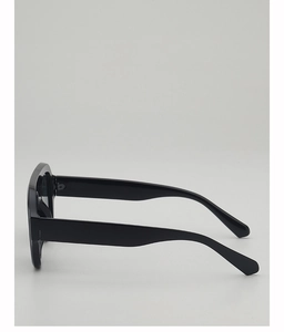 Side view of trendy black oversized aviator sunglasses with wide glossy temples