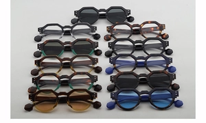 Vertical display of bold octagonal geometric eyewear frames in various vibrant colors