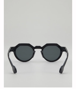 Detail of modern black geometric sunglasses frame with gradient studio lighting effect