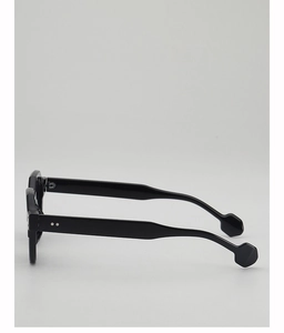 Side view of black acetate sunglasses frame with unique hexagonal temple tips and metal studs
