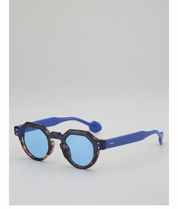 Detail of round tortoiseshell frames with vibrant blue temples and tinted blue lenses