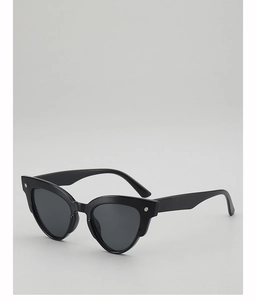 Close-up of black cat-eye sunglasses with silver cross metal rivets on the temples