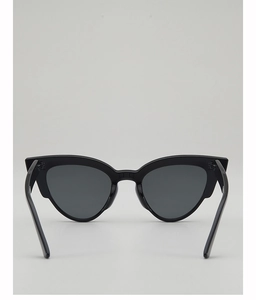 Detail view of stylish black cat-eye sunglasses with premium dark tinted lenses