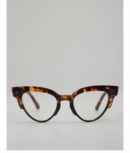 Detailed front view of retro oval tortoiseshell sunglasses with silver cross rivets