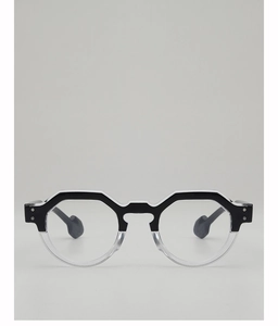 Front view of geometric round sunglasses with black white split frame and clear lenses