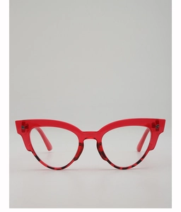 Close-up of cat-eye sunglasses with red top and leopard print bottom frame detail