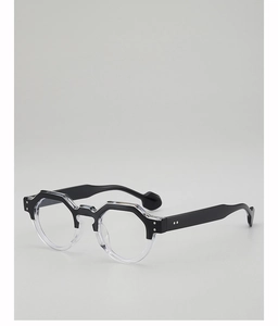 Detail of geometric monochrome sunglasses featuring black upper and clear lower frames