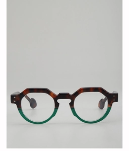 Detail of round sunglasses with tortoiseshell and green frame plus silver rivet accents