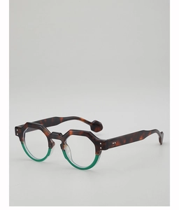 Detail of tortoise and green acetate frame with metal rivets on geometric sunglasses