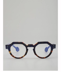 Detail of retro geometric sunglasses frame with blue tortoise shell finish and spherical tips