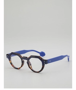Detail of round tortoiseshell frames with vibrant blue temples and silver rivets