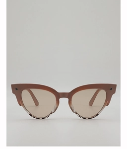 Close-up of cat-eye sunglasses with leopard print accents and metal rivets
