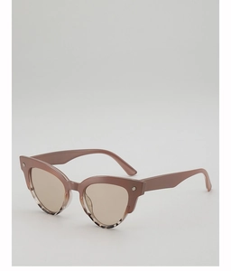 Detail of pink tortoiseshell cat eye sunglasses with silver cross rivets on the frame