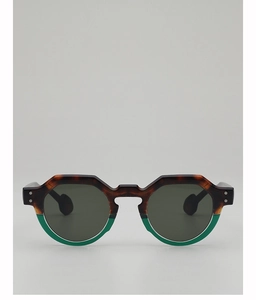 Detail of round sunglasses featuring tortoise shell pattern and emerald green color block