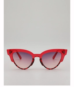 Detail of red cat-eye sunglasses with gradient lenses and faceted frame edges