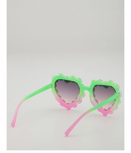 Detailed close-up of heart-shaped sunglasses with green pink gradient floral texture frame