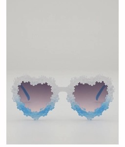 Detail of heart-shaped sunglasses with gradient lenses and 3D floral embellishments