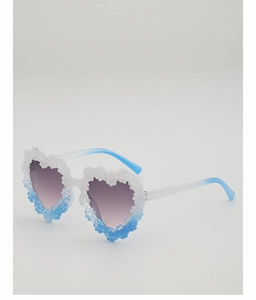 Close-up of heart-shaped sunglasses with gradient floral frame and purple lenses