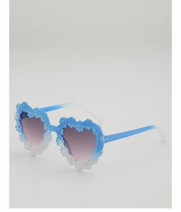 Detail of heart-shaped sunglasses featuring 3D blue floral gradient and purple lenses