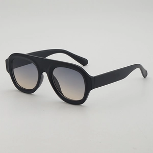 Retro oversized aviator sunglasses with matte black frames and blue-yellow gradient lenses