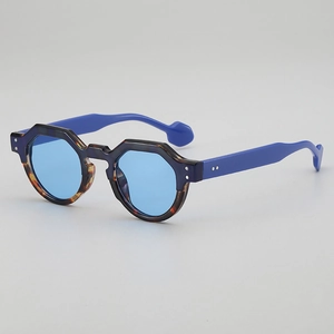 Blue geometric round sunglasses with dark tortoiseshell frames and royal blue temples