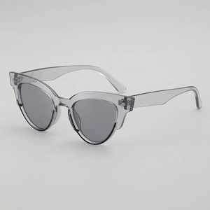 Retro cat-eye sunglasses with translucent grey frames and dark tinted lenses