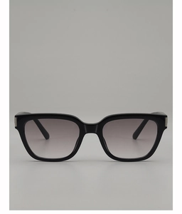 Detail of square black sunglasses with gradient grey lenses and silver metal hinges