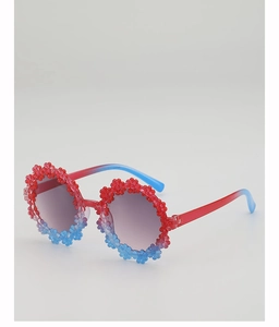 Detail of flower shaped kids sunglasses with red and blue gradient round frames