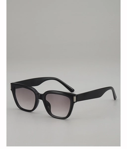 Close-up of classic black square sunglasses featuring gradient lenses and silver metal accents