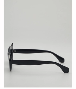 Detail of black oval sunglasses featuring silver circular metal hinge accents on the temple