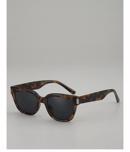 Detail of tortoise shell square sunglasses with silver metal decor on the temples