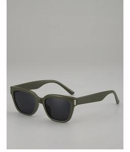 Detail of olive green square sunglasses featuring silver metal accents and dark lenses