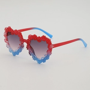 Kids heart-shaped sunglasses with red-blue gradient frame and floral decorations