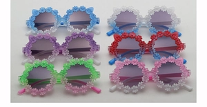 Detail view of colorful daisy flower children sunglasses with cute cat ear frame design