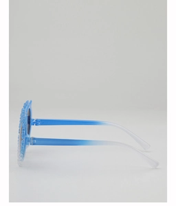 Detail view of daisy flower decorations on blue and white gradient kids sunglasses