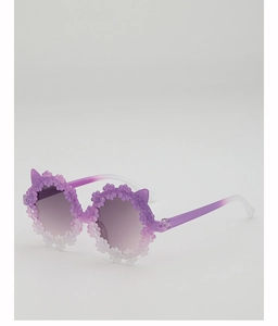 Close-up of kids sunglasses featuring purple 3D flowers and cute cat ear details
