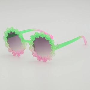 Daisy shaped kids sunglasses with green and pink gradient frame and purple lenses