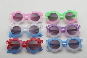 Detailed set of six flower-shaped kids sunglasses in various gradient jelly colors