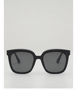Front view of classic black thick-frame sunglasses with dark grey lenses for sun protection