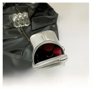 Silver mirror mini bag interior showing capacity for lipsticks and beauty essentials
