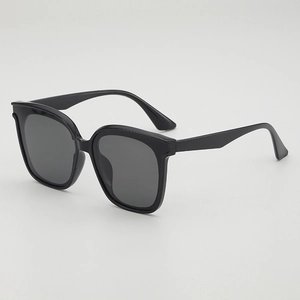 Classic oversized black frame sunglasses with dark grey lenses for retro stylish travel