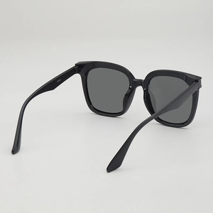 Vintage oversized black square sunglasses with dark grey polarized lenses for UV protection