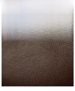 Close-up of brown litchi pattern leather showing durable texture and refined grain