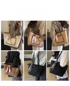 Viste dettagliate di varie borse tote con manici a nastro e texture pelle martellata