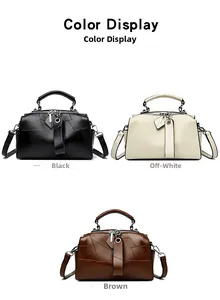 Close-up of three Boston bags in black, white, and brown with lychee grain texture