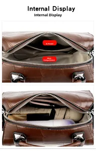 Detail view of the brown Boston bag interior with a spacious main compartment and side pocket